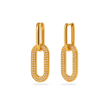 Gold hoop earrings with embedded stones on a white background
