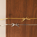 BOW NECKLACE - 18K WHITE/GOLD-PLATED