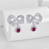 RUBY BOW STUDS - Fine Silver